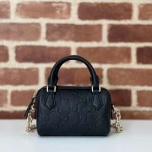 GUCCI GG Emblem medium boston bag in Black Leather